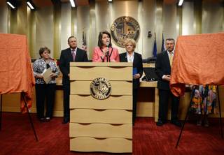 State Attorney General Catherine Cortez Masto encourages struggling homeowners to contact Home Again, a one-stop shop to receive free financial counseling, during an event promoting the organization Thursday, June 6, 2013,  at Las Vegas City Hall.